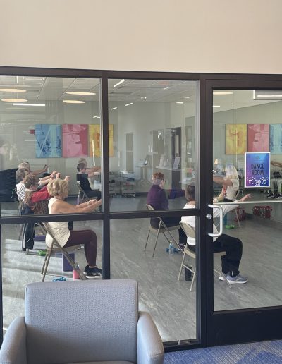 A Picture of a Group Doing Chair Yoga