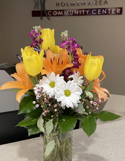 A Picture of a Vase of Flowers on a Desk