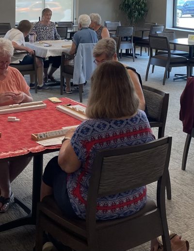 A Picture of of a Group Playing Mah Jongg